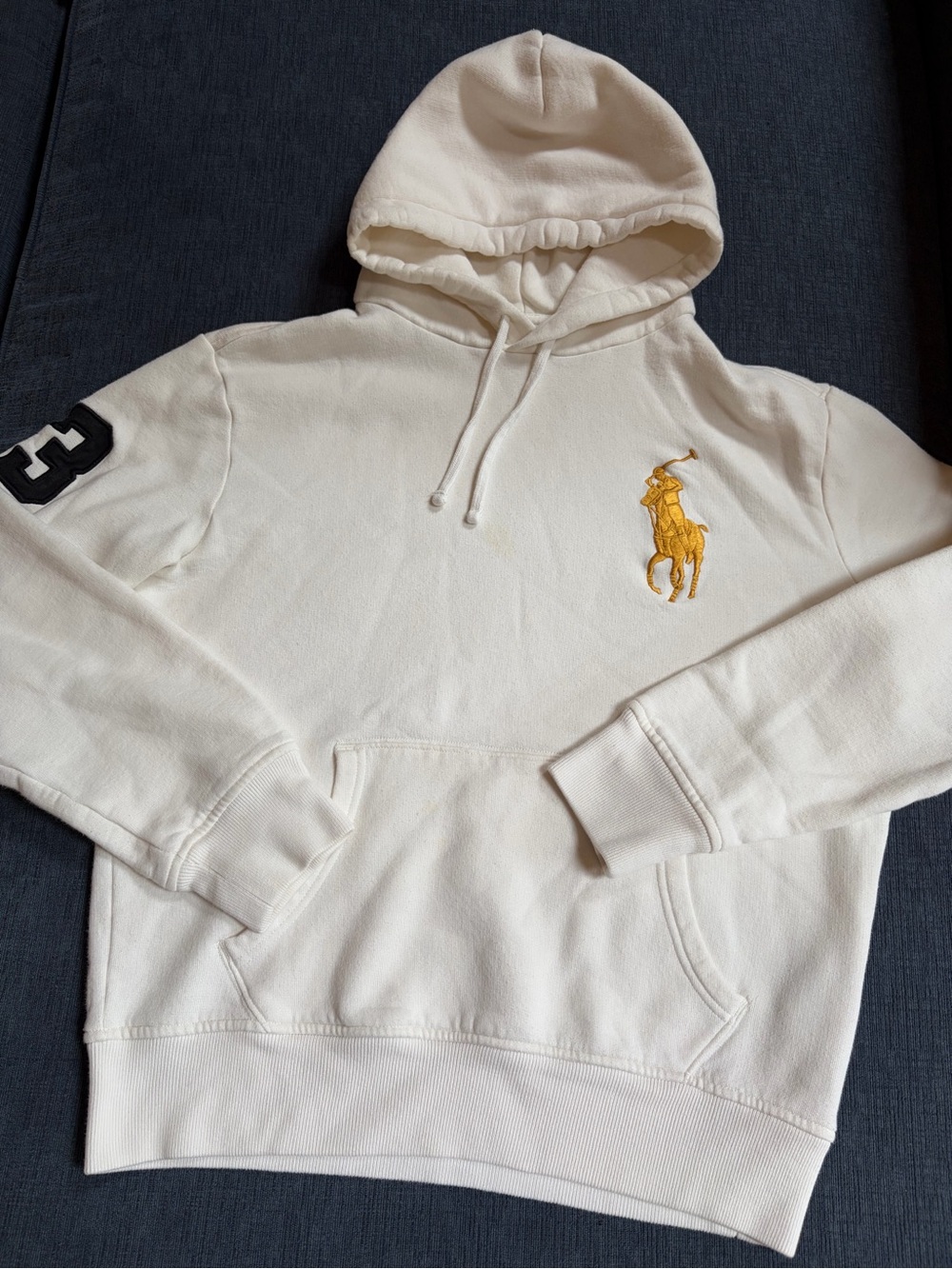 Ralph Lauren Cream Pullover Hoodie with Gold Polo Emblem and Black Sleeve Patch